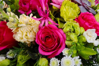 Mixed flower arrangement: various flowers in different colors clipart