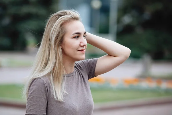 Young Pretty Blonde Smiles Background Green Foliage — Stock Photo, Image