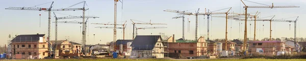 Many residential houses in working construction — Stock Photo, Image