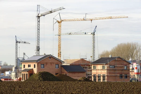 Many residential houses in working construction — Stock Photo, Image