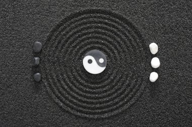  Japanes zen garden with yin and yang stones in raked sand clipart