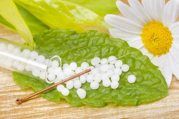 Alternative medicine with herbal and homeopathic pills and acupuncture — Stock Photo, Image