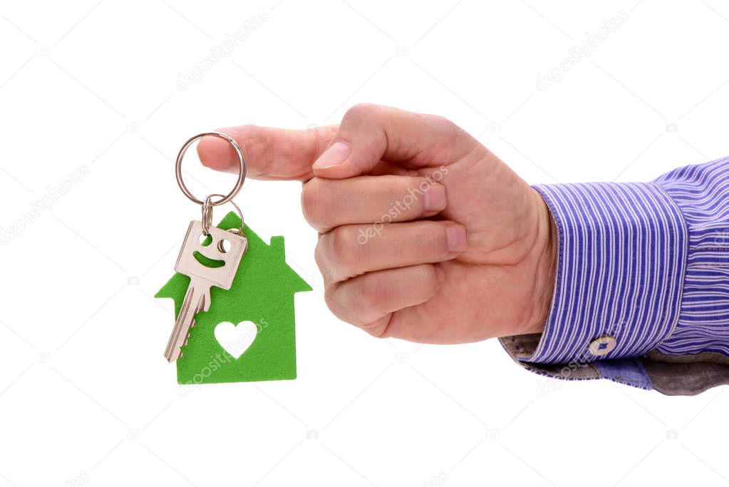  house key in hand of real estate agent isolated over white background