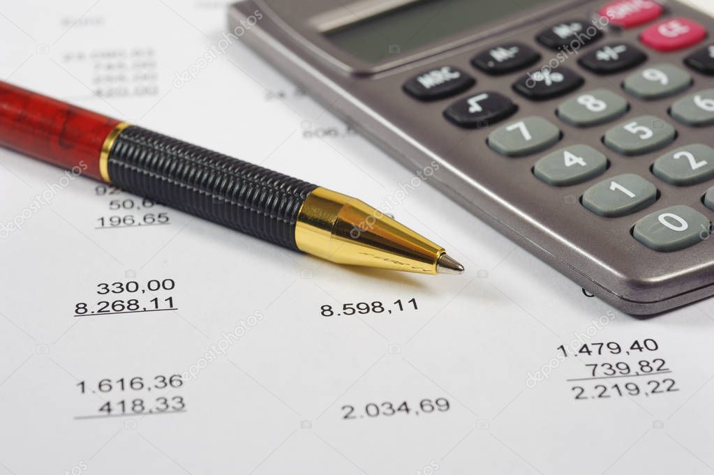  financial invoice with calculator and pen