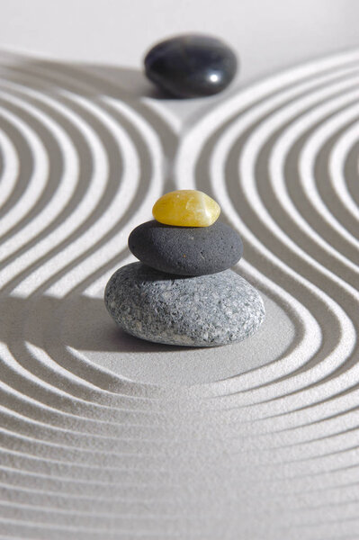 Japanese Zen garden of tranquility with stone in textured sand