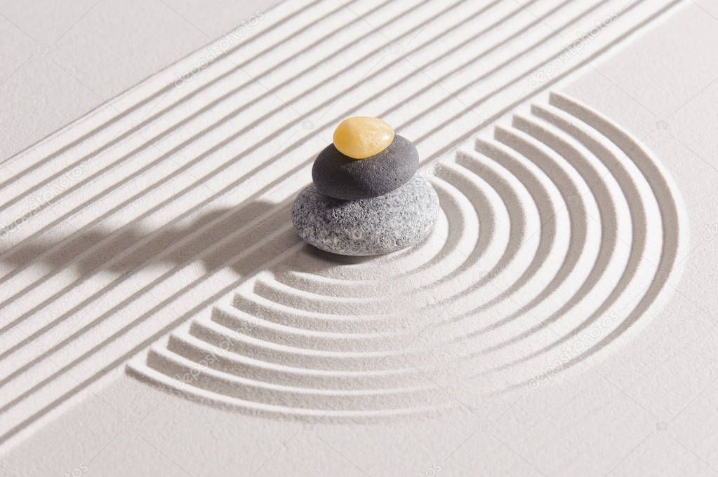 Japanese Zen garden of tranquility with stone in textured sand