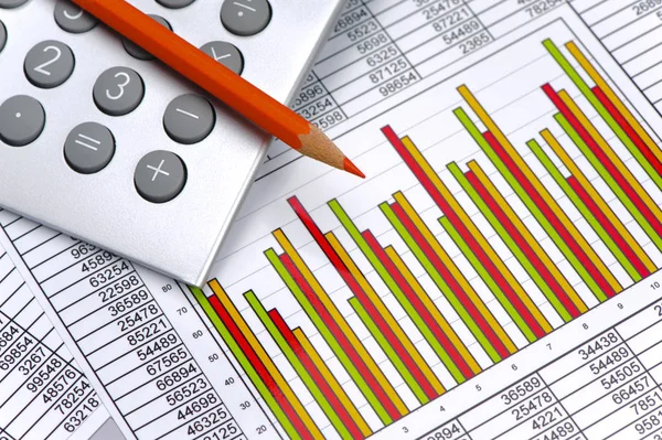 Calculator and pencil laying on financial business chart — Stock Photo, Image