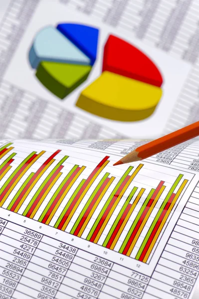 Pencil laying on financial business chart — Stock Photo, Image