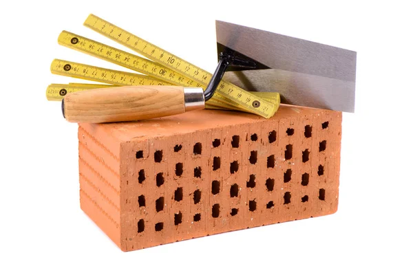 Tegel för husbyggnad och verktyg isolerade över vita backg — Stockfoto