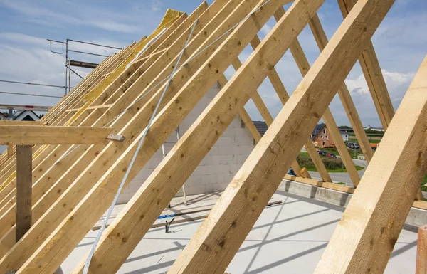 framework of new built roof on residential house in construction