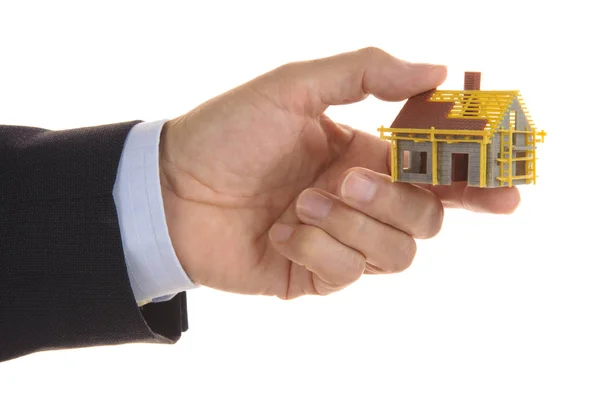 Modelu dom symboliczne na sprzedaż w ręce agenta — Zdjęcie stockowe