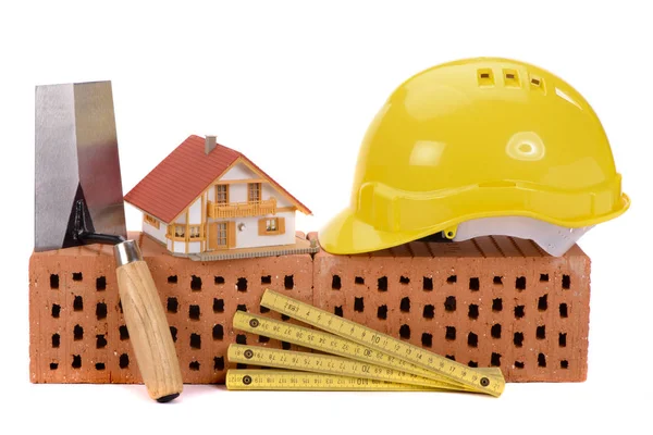 House construction with brick, tools,  plan and model house — Stock Photo, Image