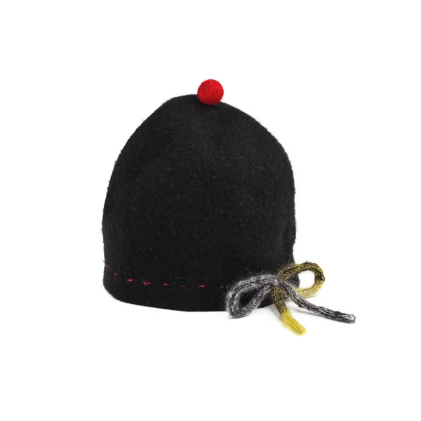 Czarny kapelusz z czerwonym pompon — Zdjęcie stockowe