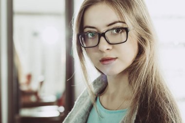 portrait of young woman wearing glasses clipart