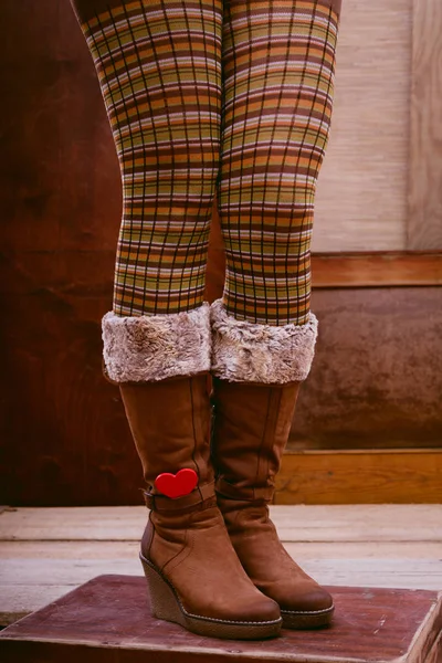 Legs and big winter boots — Stock Photo, Image