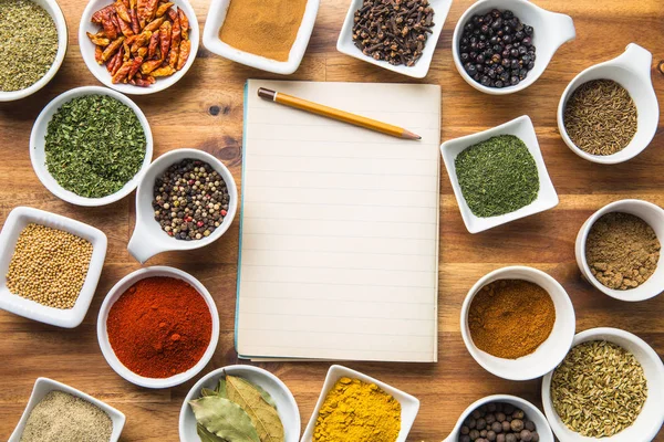 Various spices and blank notebook. — Stock Photo, Image