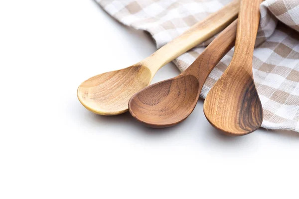 Tre cucchiai di legno e tovagliolo a quadretti . — Foto Stock