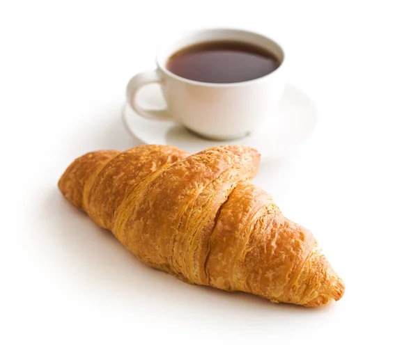Smakelijke boterachtige croissantje en kopje koffie. — Stockfoto