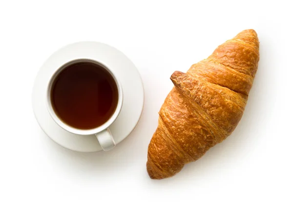 Tasty buttery croissant and cup of coffee. — Stock Photo, Image