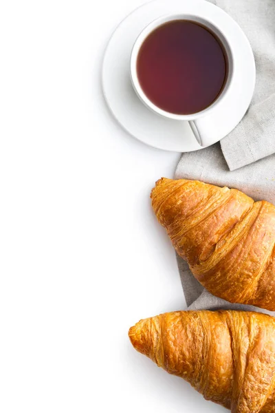 Tasty buttery croissant and cup of tea. — Stock Photo, Image
