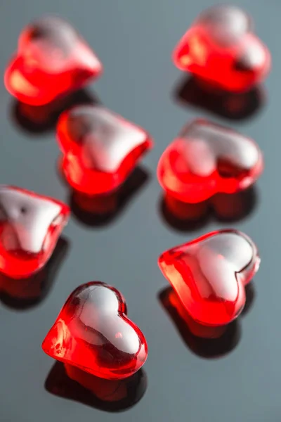 Red hearts on black table. — Stock Photo, Image