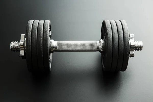 The metal dumbbell. — Stock Photo, Image