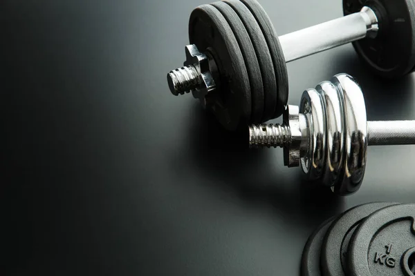 The metal dumbbell and weights. — Stock Photo, Image