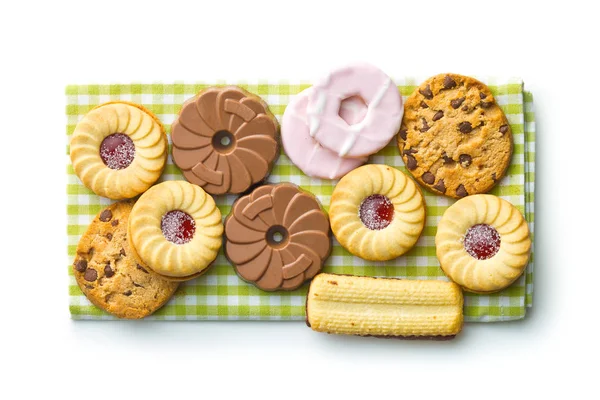 Divers biscuits sucrés sur une serviette à carreaux . — Photo