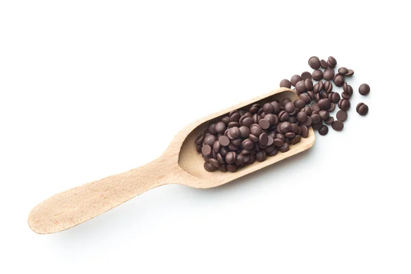 Sabrosos bocados de chocolate en cuchara de madera . — Foto de Stock