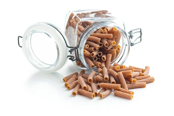 Dried rigatoni pasta in jar. — Stock Photo, Image