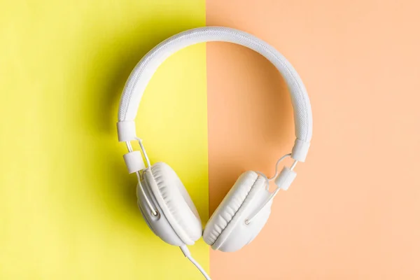 Headphones on double colorful background. — Stock Photo, Image