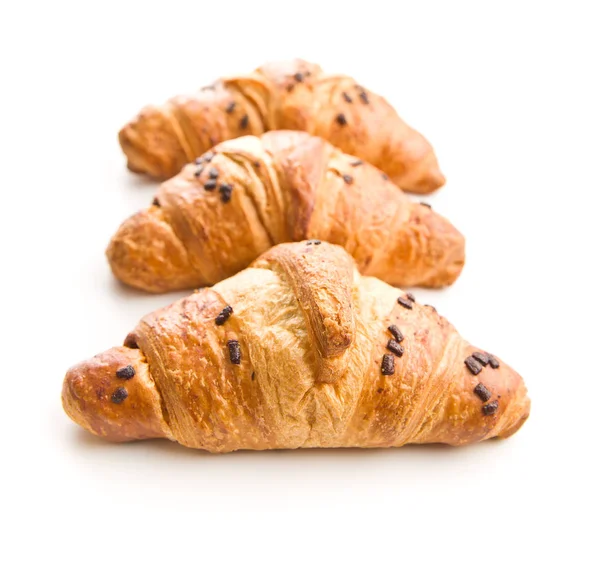 Three croissants with chocolate crumbs. — Stock Photo, Image