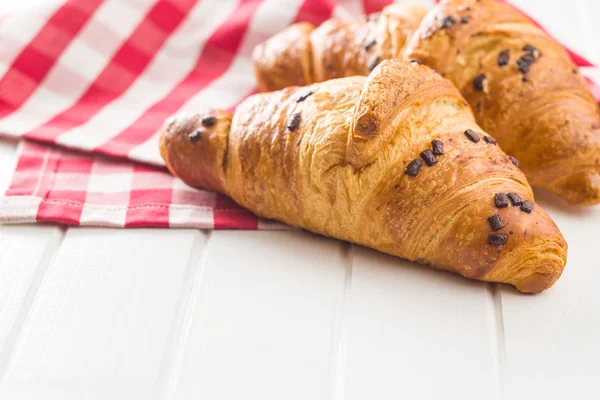 Two croissants with chocolate crumbs. — Stock Photo, Image