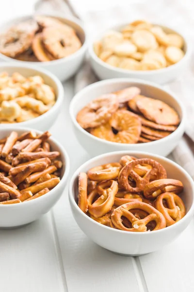 Mixed salty snack crackers and pretzels. — Stock Image Mixed salty snack crackers and pretzels. Stock Photo