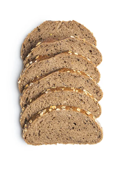 Sliced whole grain bread with oat flakes. Wholemeal bread. — Stock Photo, Image