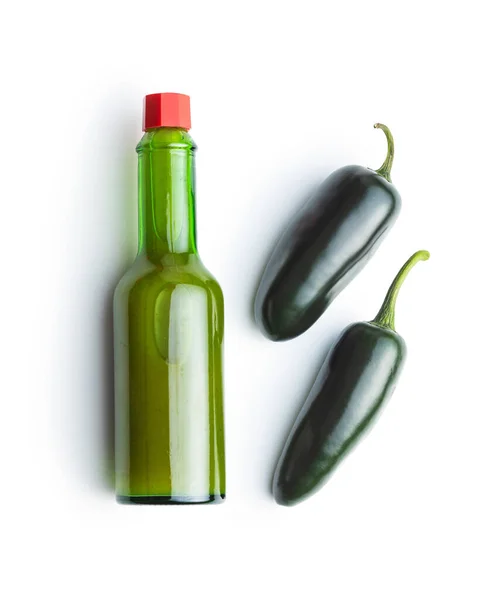 Green jalapeno pepper and tabasco sauce. — Stock Photo, Image