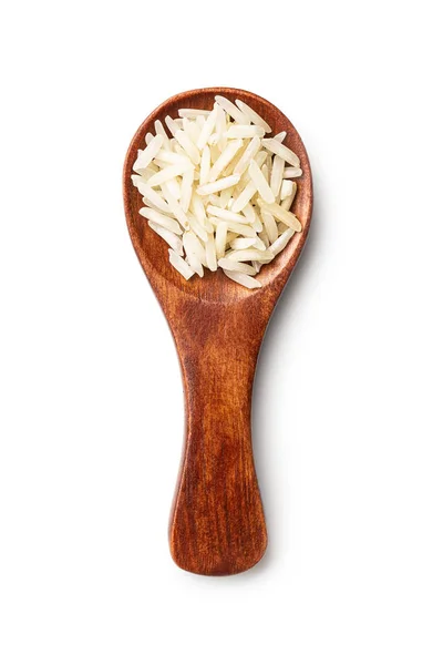 Неварений індійський довгий рис в дерев'яній ложечці . — стокове фото