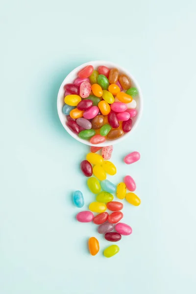 Jellybeans Fruités Gelée Colorée Savoureuse Haricots Sur Fond Coloré — Photo