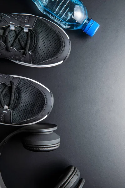 Fitness Concept Black Sports Shoes Headphones Bottle Water Black Table — Stockfoto