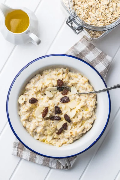Bowl Oatmeal Porridge Raisins White Table — Stock Photo, Image