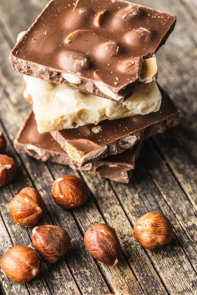 Dark Nut Chocolate Hazelnuts Broken Chocolate Bar Black Kitchen Table — Stock Photo, Image