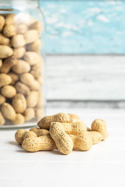 Tasty Unpeeled Peanuts Peanuts Nutshell White Table — Stock Photo, Image