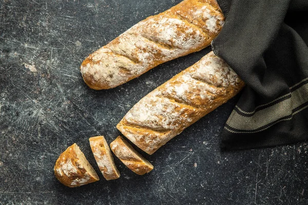 Fresh Whole Grain Bread Baguette Black Table Top View — Stock Photo, Image