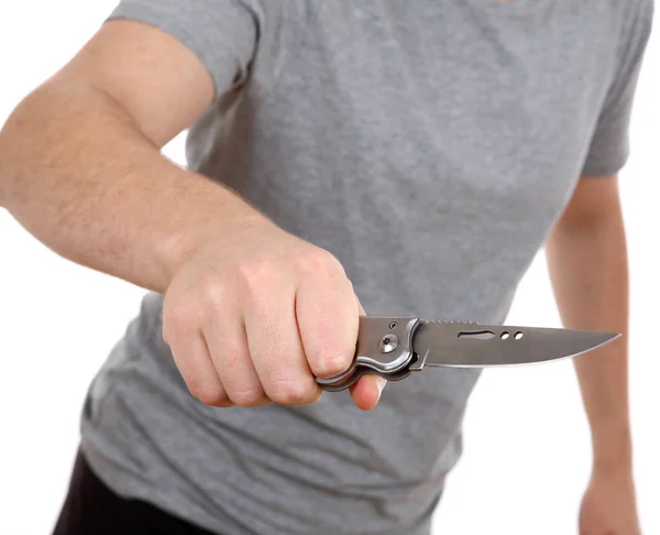 Молодой человек держит нож изолирован на белом фоне — стоковое фото