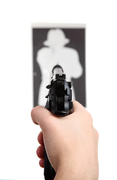 Hand with gun shooting target — Stock Photo, Image
