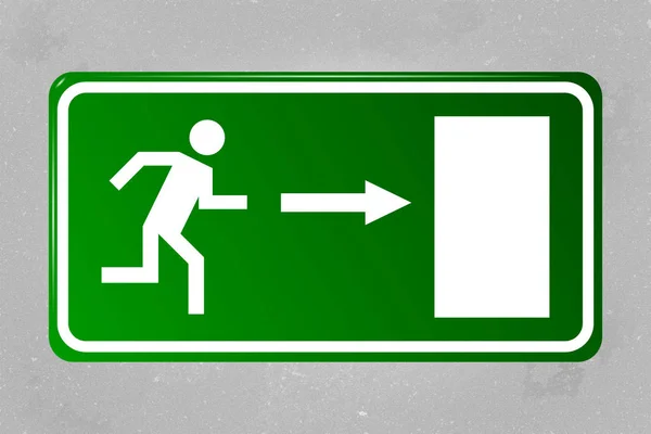 Emergency exit sign hanging on a concrete wall — Stock Photo, Image