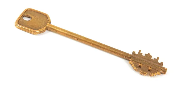 Old brass key on white background — Stock Photo, Image