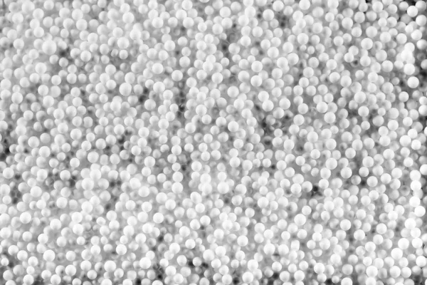Malé bílé kuličky plastickým vzorem — Stock fotografie