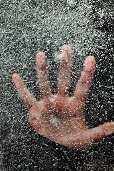 Mans hand below frozen lake drowning — Stock Photo, Image