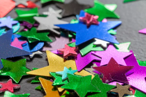 Party Confetti Multi Colored Stars Shaped Close Scatted Black Table — Stock Photo, Image